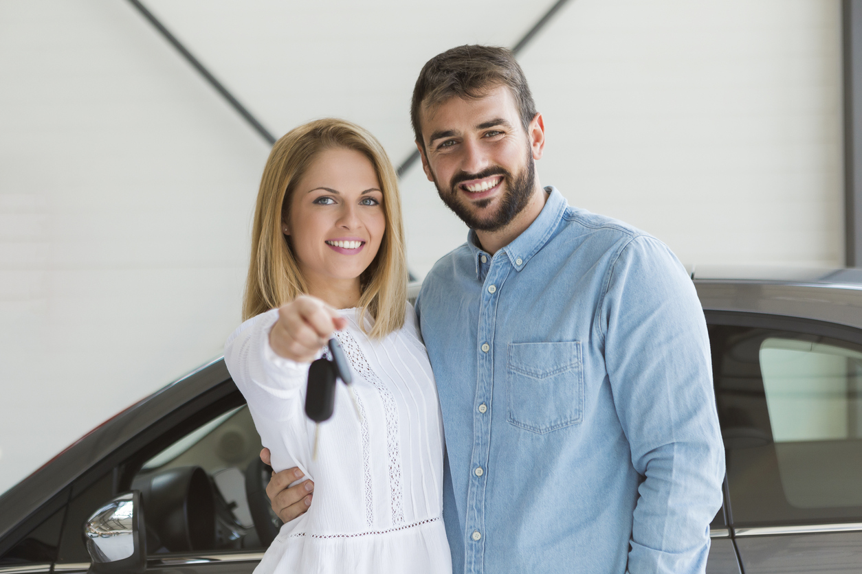 A set of happy customers that financed their vehicle here at Savage L&B, in Robesonia, PA. iStock/Nastasic